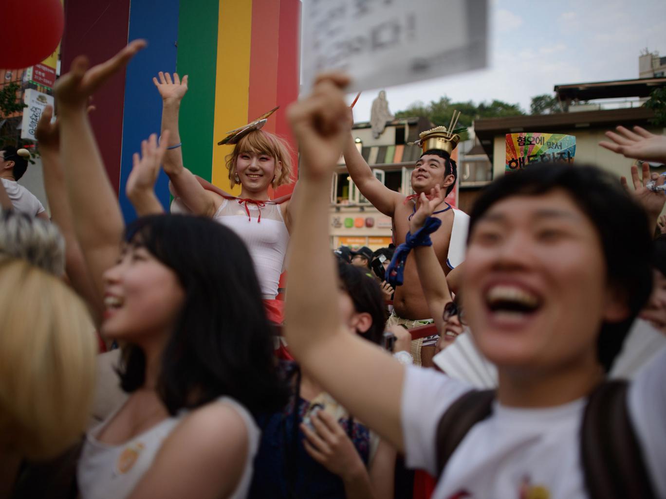 Members of the LGBT community take part in a Gay Pride parade in Seoul. Many younger Koreans preach tolerance and equality